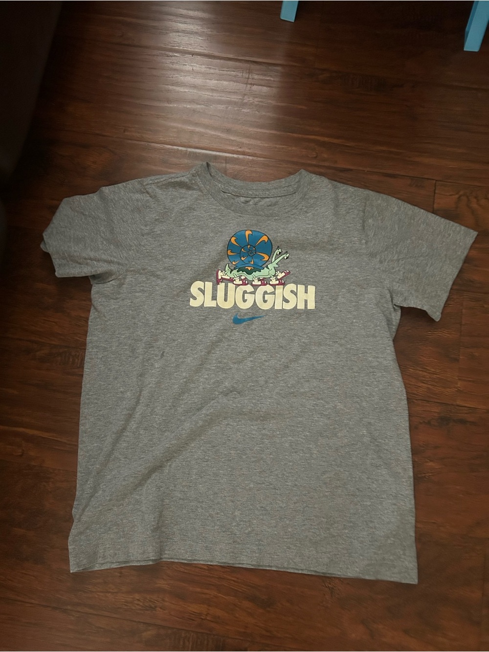 Nike Kids Gray Tee with Colorful 'Sluggish' Character Graphic
